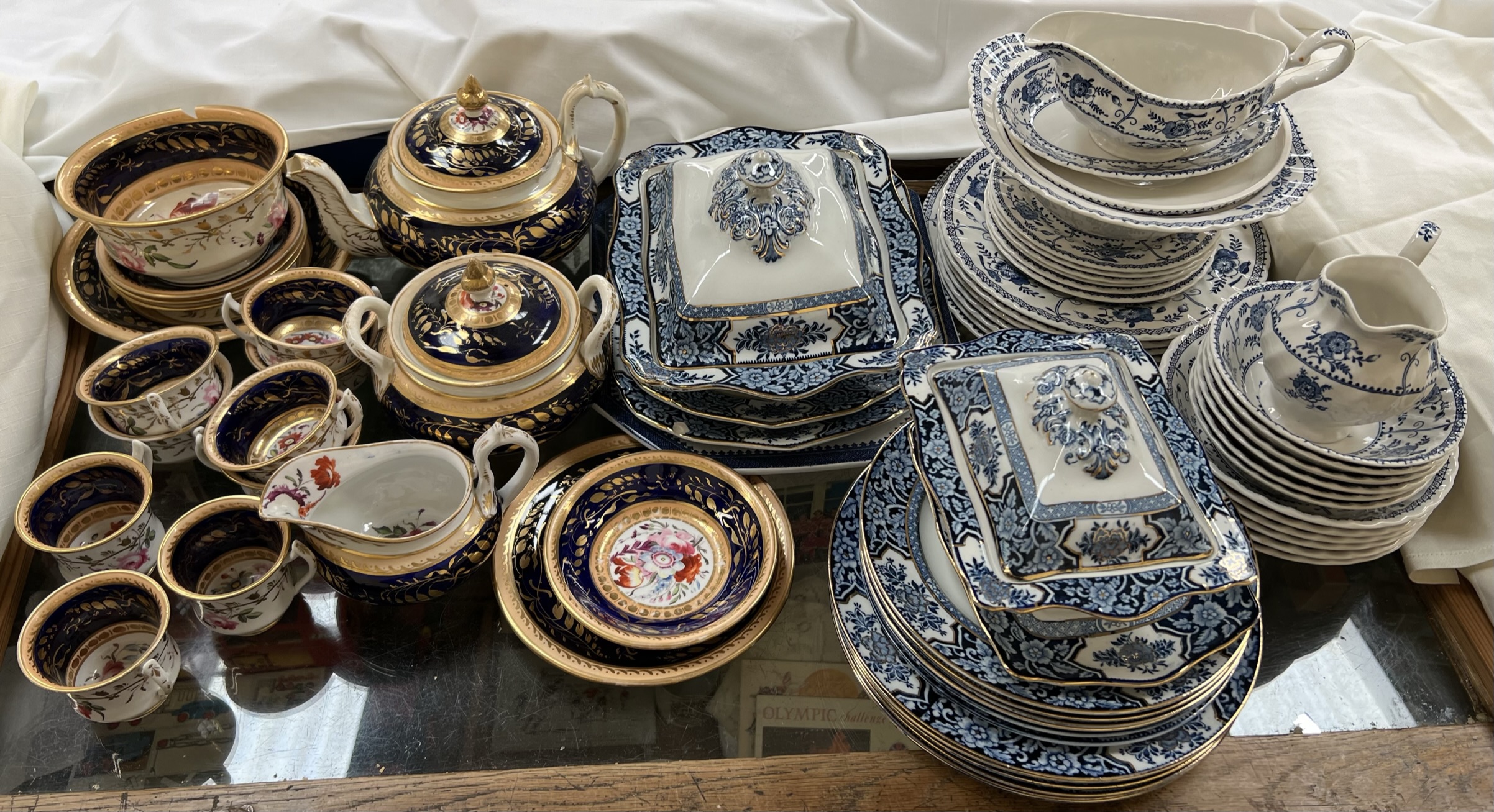 A 19th century pottery floral decorated part tea service together with blue and white part dinner