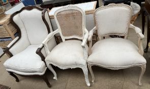 A continental upholstered wing back chair with pad upholstered back,