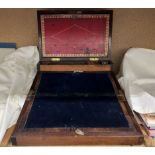 A 19th century mahogany laptop desk, with a pen tray and ink wells,