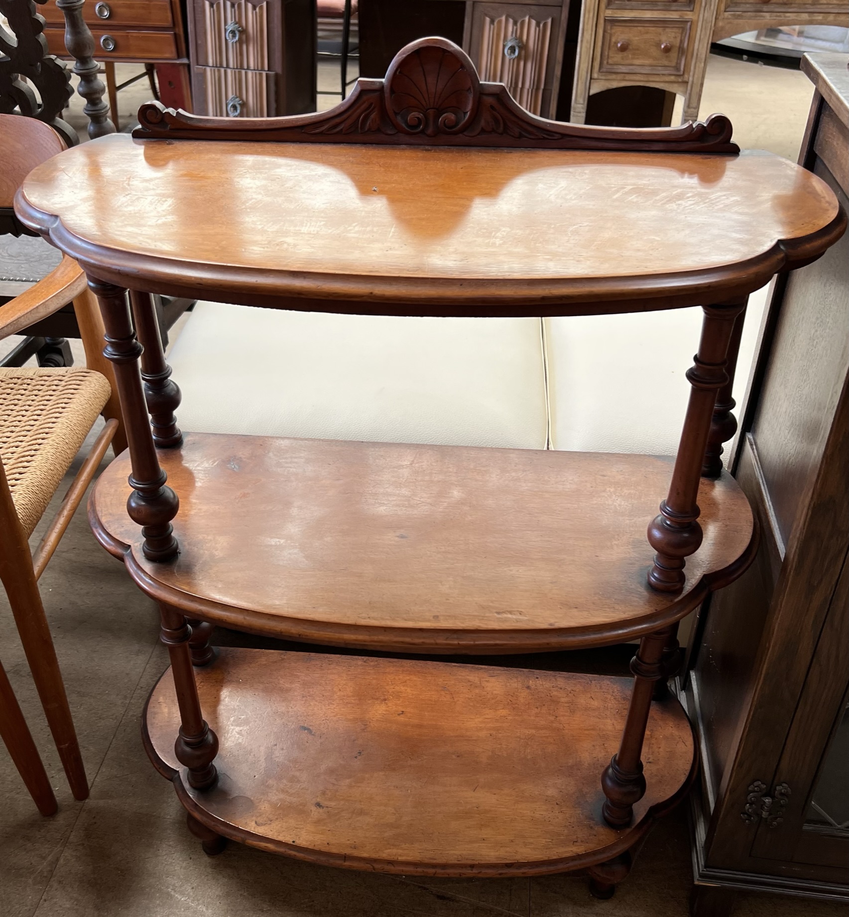 A Victorian walnut three tier whatnot,