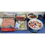 Assorted board games together with lego, model cars,