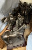 A collection of moulded resin racehorse models