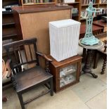 A cast iron painted stick stand together with a tripod table, a Lloyd Loom laundry basket,
