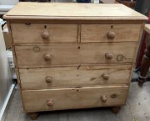 A Victorian pine chest with a rectangular top with rounded corners above two short and three long