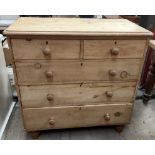 A Victorian pine chest with a rectangular top with rounded corners above two short and three long