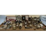 Assorted electroplated wares including sugar casters, hot water pots, egg cups, flatwares,