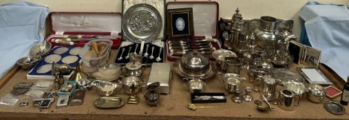 Assorted electroplated wares including sugar casters, hot water pots, egg cups, flatwares,