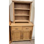 A 20th century oak side cabinet with two drawers and two cupboards on square legs together with a