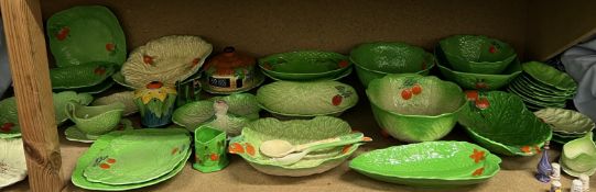 A large collection of Beswickware, Crown Devon, Carltonware and other pottery leaf decorated plates,