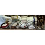 A display cabinet together with a collection of miniature timepieces together with part tea sets,