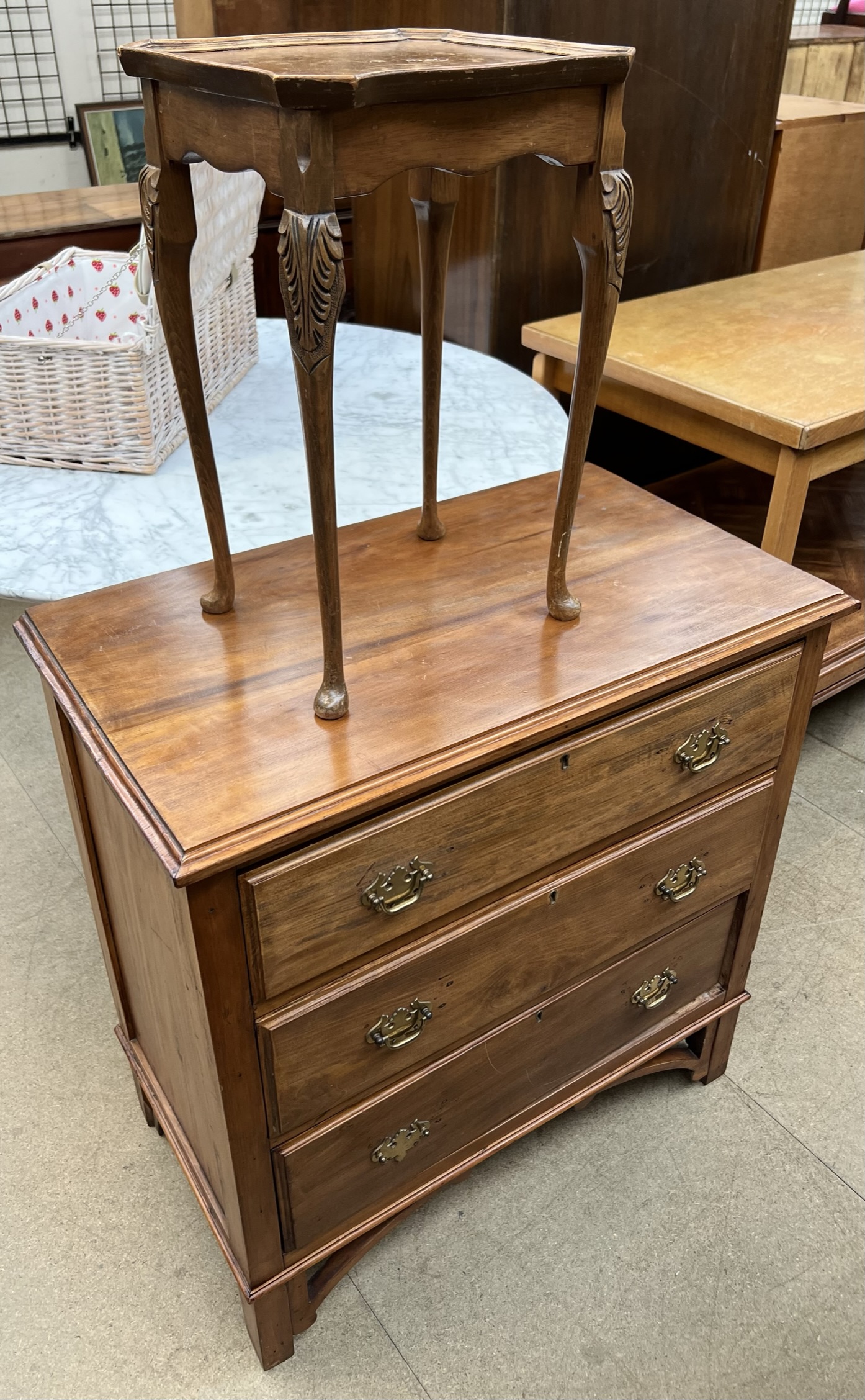 A walnut chest with a rectangular top above three drawers on bracket feet together with a small