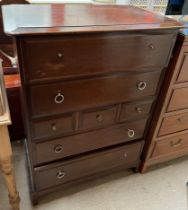 A Stag chest of drawers on bracket feet