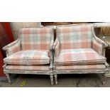 A pair of continental upholstered arm chairs with cream and pink chequer upholstered back seat and