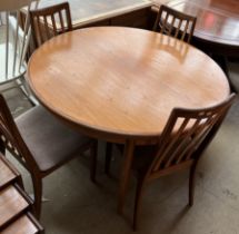 A G Plan teak extending dining table and four chairs