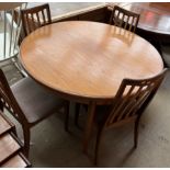 A G Plan teak extending dining table and four chairs