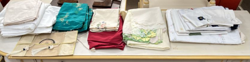 A collection of table and bed linens,