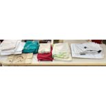 A collection of table and bed linens,