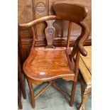 A Chinese hardwood corner elbow chair with vase shaped splats on tapering legs