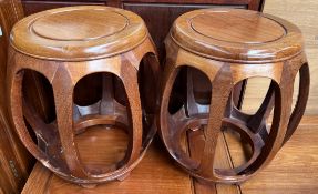 A pair of Chinese hardwood barrel stools