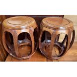 A pair of Chinese hardwood barrel stools