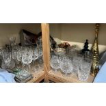 A large collection of crystal drinking glasses together with a liquer set etc