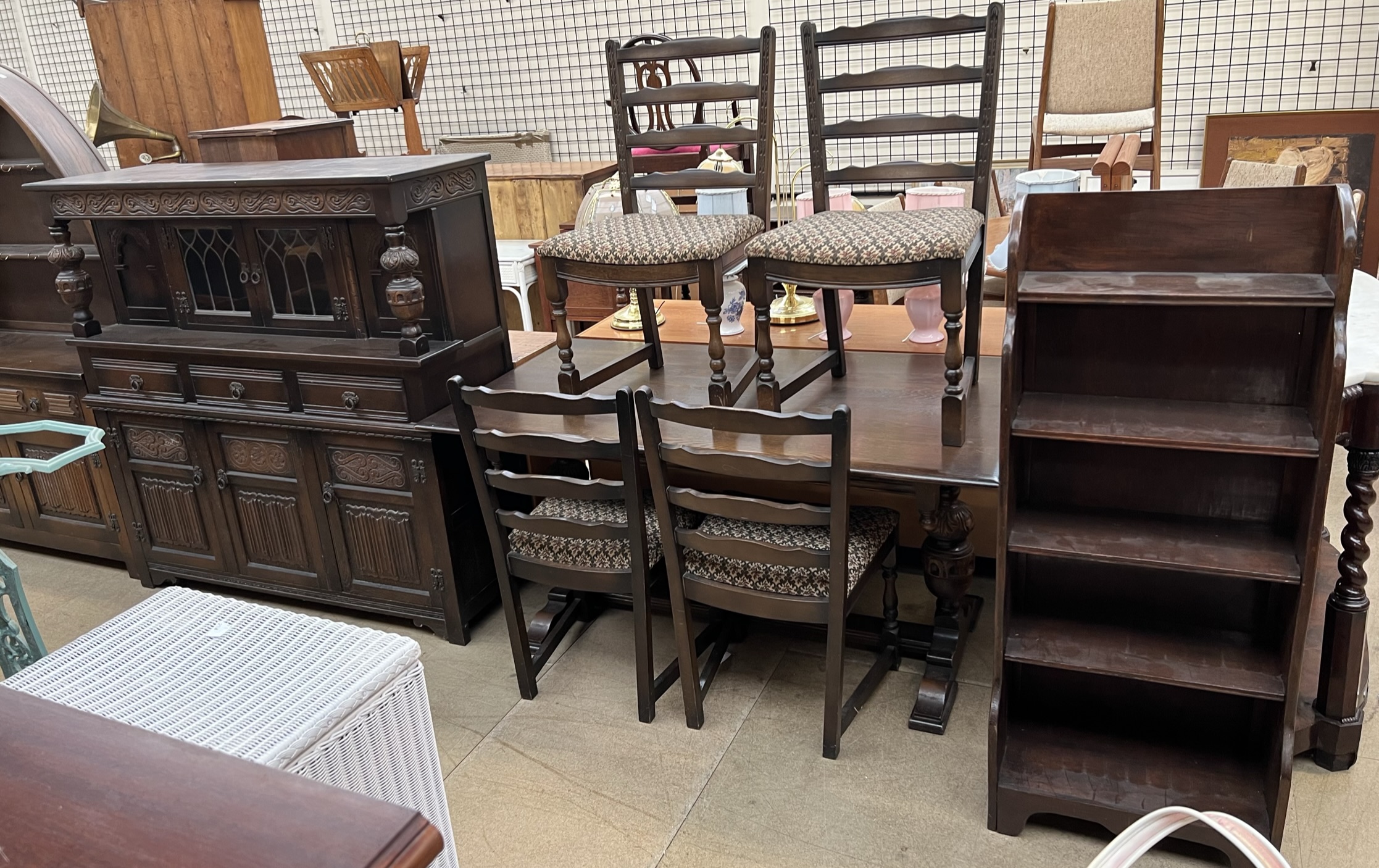 A 20th century oak refectory table and four chairs together with an oak court cupboard and a