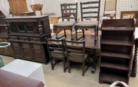 A 20th century oak refectory table and four chairs together with an oak court cupboard and a