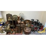 A collection of shoe lasts together with a copper kettle, copper jugs, oil lamp, brass wares,