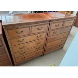 A pair of Chinese hardwood chests with a rectangular top above two short and four long drawers on