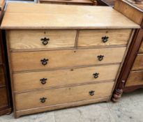 An Edwardian ash chest with a rectangular top above two short and three long drawers on bracket