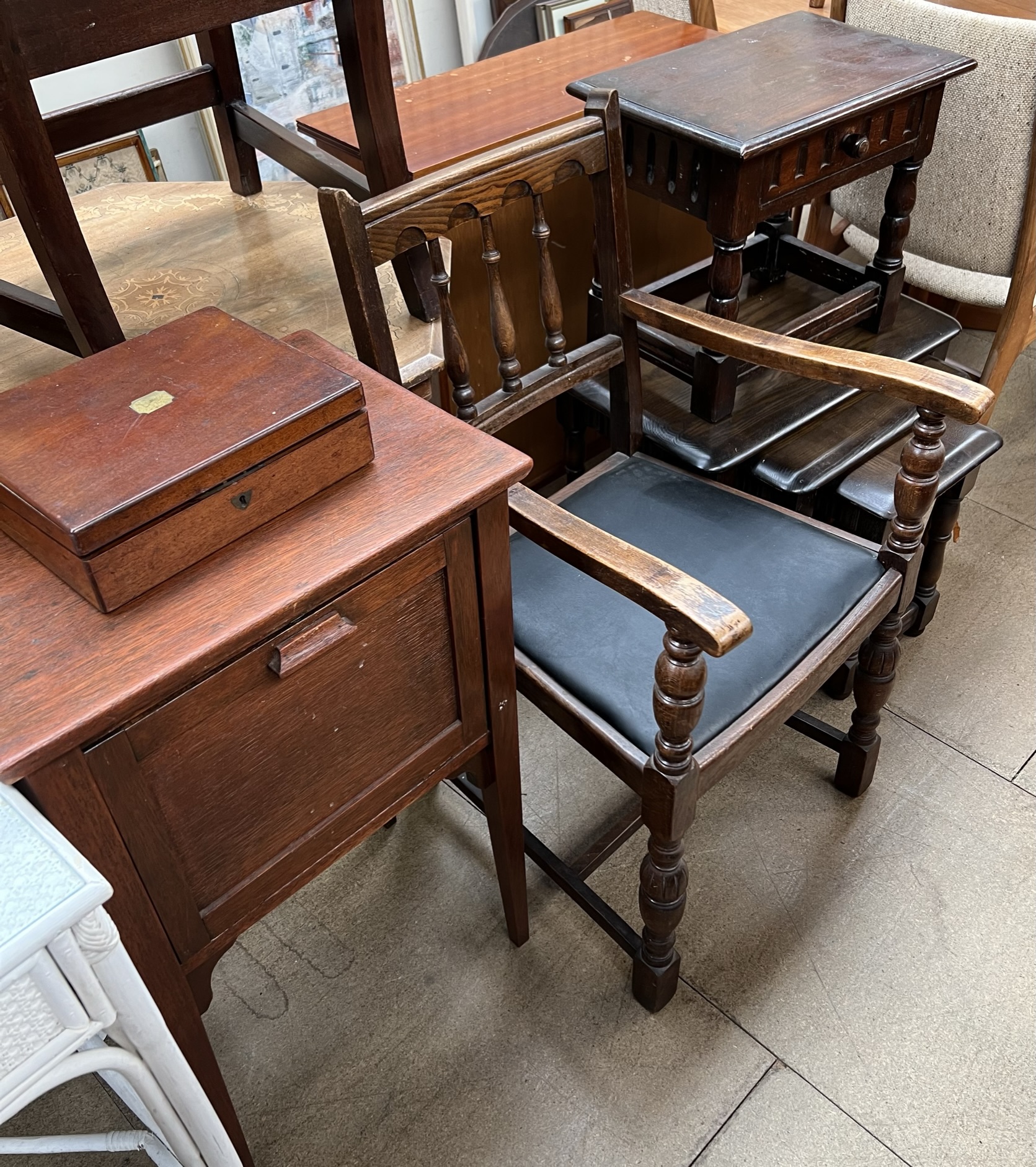 A 20th century oak side table with a frieze drawer and turned legs united by stretchers together