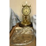 A Kundo anniversary clock together with a glass rabbit jelly mould
