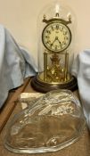 A Kundo anniversary clock together with a glass rabbit jelly mould