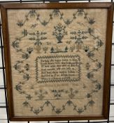 An early Victorian sampler decorated with vases of flowers,