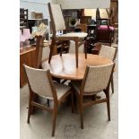 A mid 20th century teak dining suite including an extending dining table,