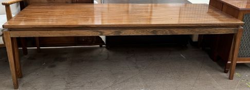 A mid 20th century coffee table on square tapering legs,