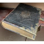 A leather bound Welsh bible with brass corners and clasps