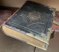 A leather bound Welsh bible with brass corners and clasps