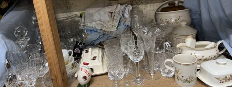 Cut glass decanters together with drinking glasses, linen,