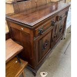 An Edwardian walnut sideboard base,