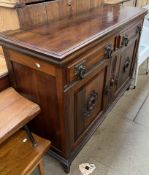 An Edwardian walnut sideboard base,