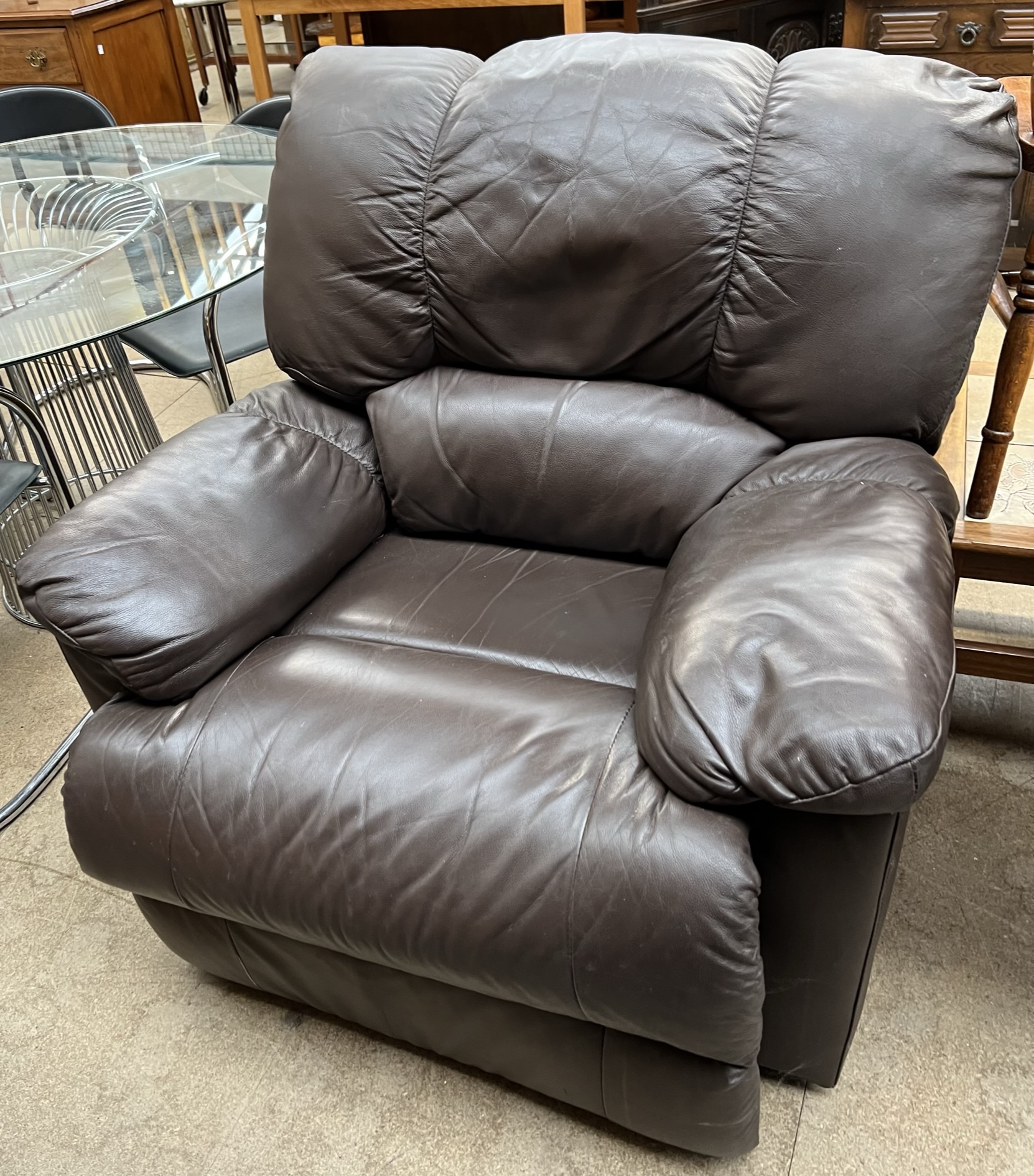 A brown leather reclining chair