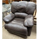 A brown leather reclining chair