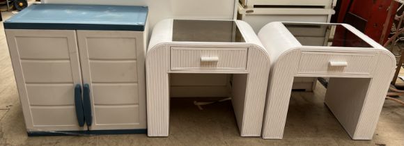 A pair of white painted and mirrored bedside tables together with a garage two door cabinet