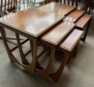 A G Plan teak nest of three tables together with another teak nest of tables