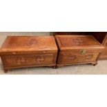 A pair of Chinese hardwood coffer with a hinged rectangular top and carved front on bracket feet,