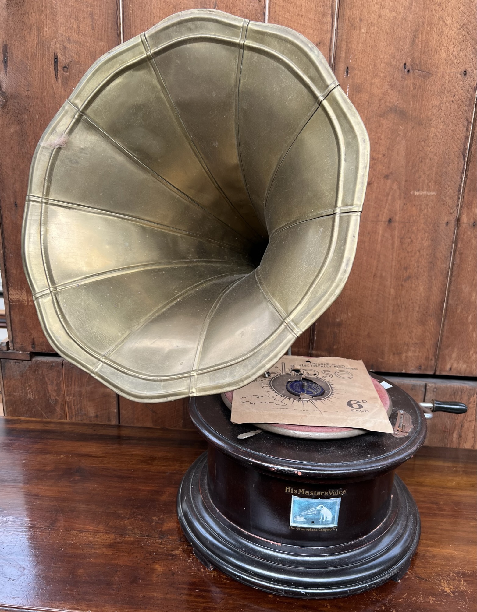A reproduction HMV gramophone with brass trumpet
