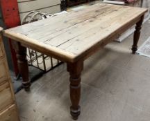A Victorian and later pine refectory table, the planked rectangular top on four turned legs,