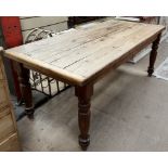 A Victorian and later pine refectory table, the planked rectangular top on four turned legs,