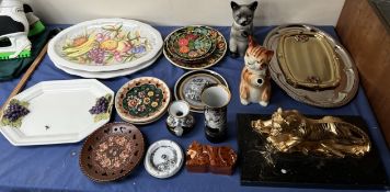 A gilt metal tiger on a marble base together with pottery meat plates, cat teapots,